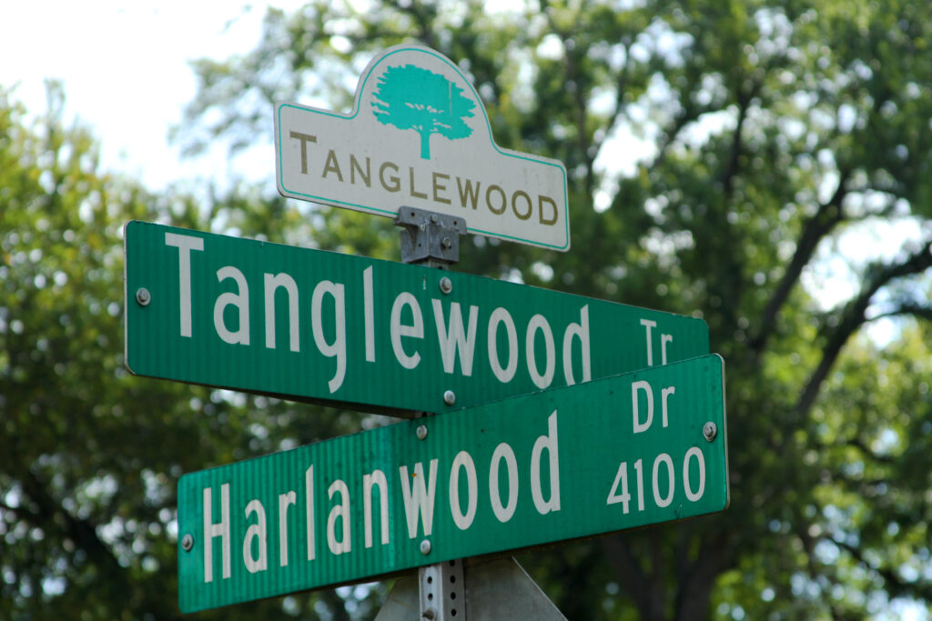 Homes among mature trees in the Tanglewood neighborhood of Fort Worth, Texas