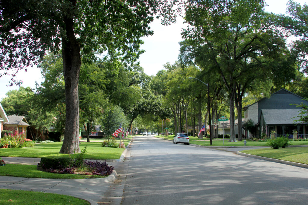 Tree-lined residential street in the Tanglewood neighborhood of Fort Worth, Texas