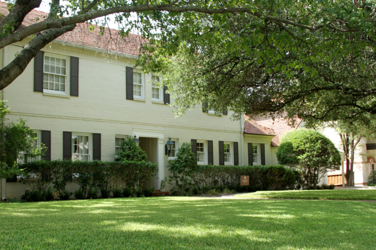 Brick home with mature trees in the Colonial area of Fort Worth, Texas