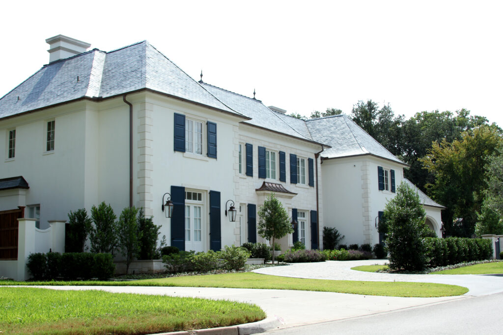 White Colonial-style home with black shutters in Fort Worth's Colonial neighborhood
