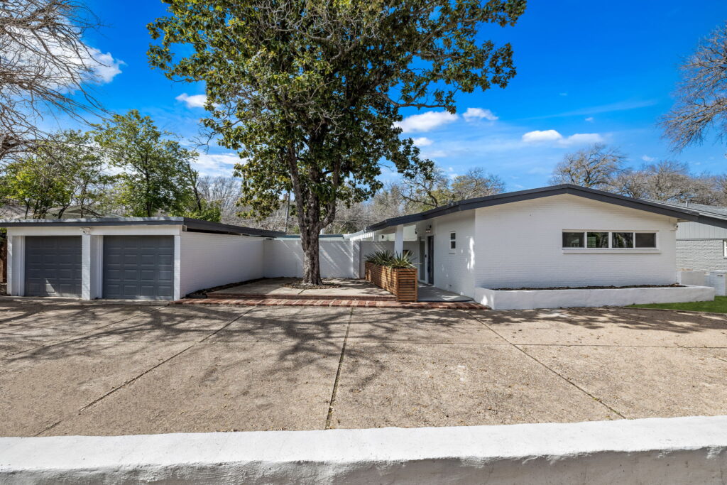 White painted brick mid-century ranch home in Overton Park, Fort Worth